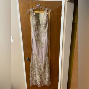 Beautiful mauve dress with gold accents.